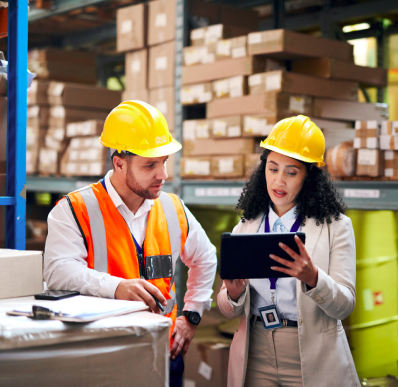 industry-expertise Two importers check inventory in warehouse