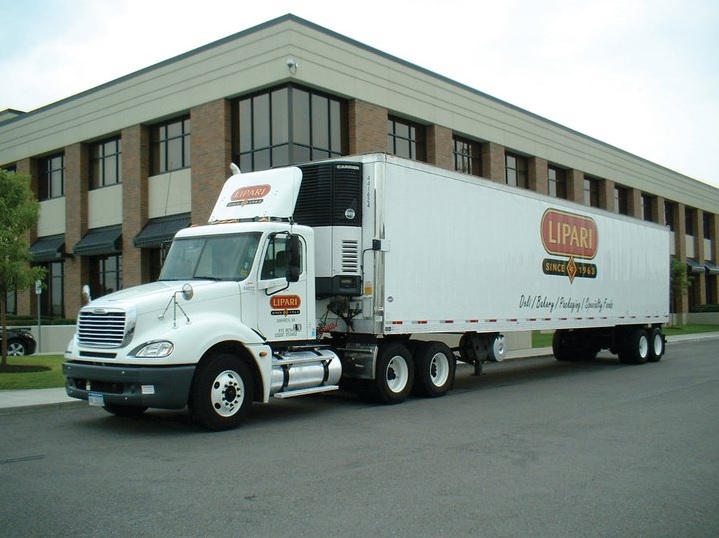 Lipari Foods Photo of white Lipari Food truck with logo in front of a corporate building.