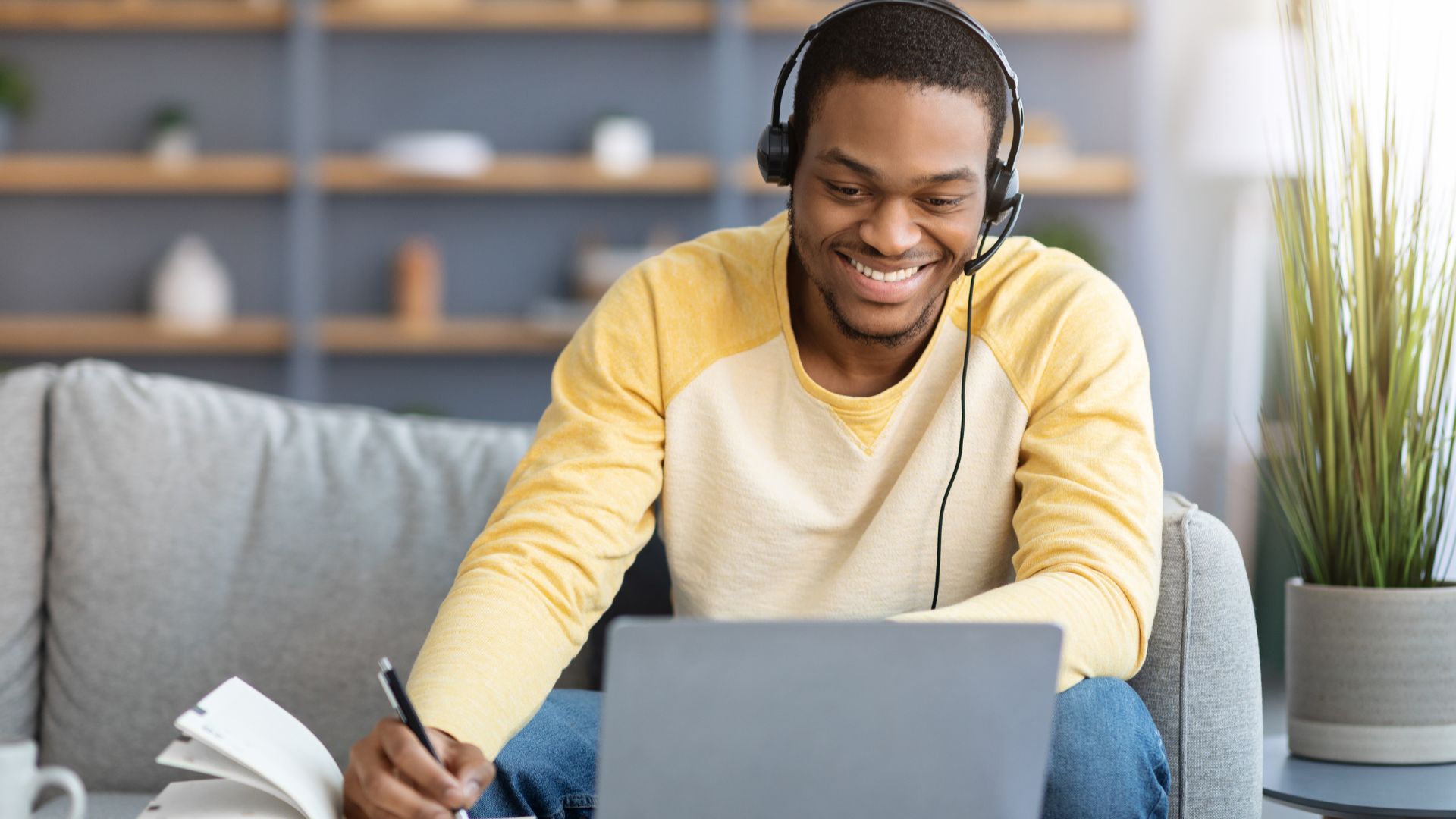 A young man sits at hos couch taking FSVP Training.